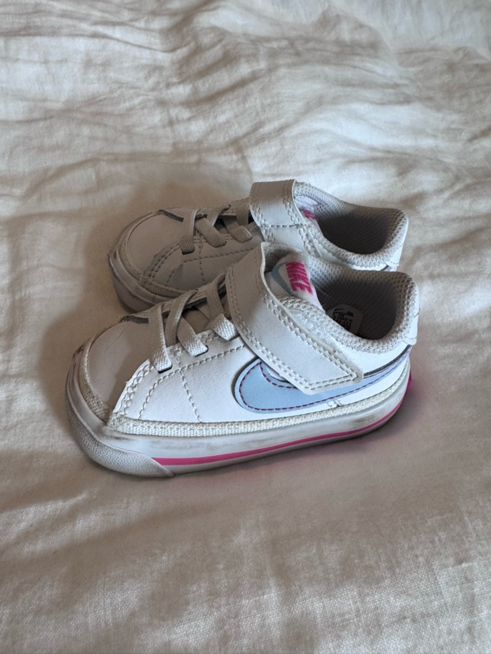 Nike Kids White Sneakers with Light Blue Swoosh and Pink Accents